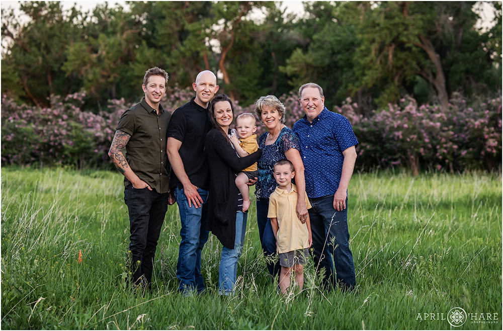 Beautiful sunset portrait of a family with Lilacs in the backdrop at Bear Creek Greenbelt in Lakewood Colorado