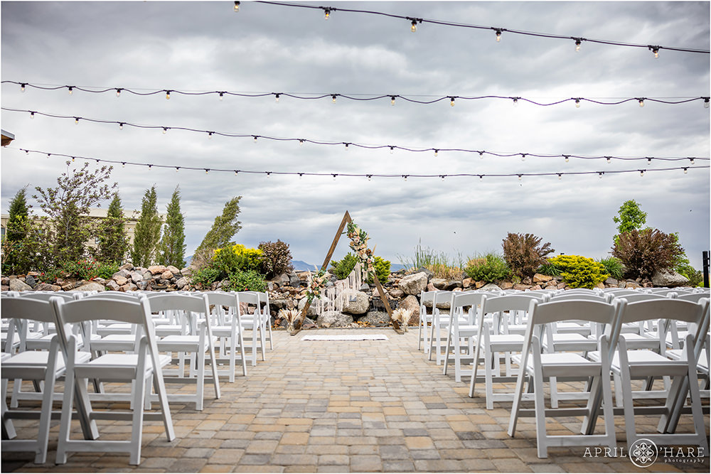 Outdoor bohemian styled patio vow renewal on a stormy spring day in Littleton Colorado