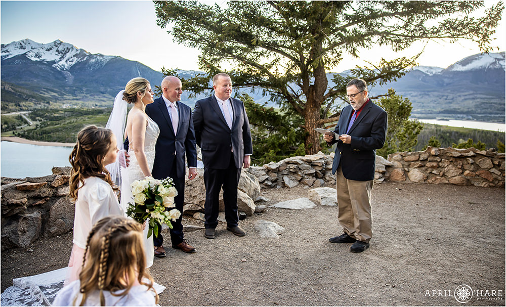 Family does a reading at a small wedding ceremony at Sapphire Point in Colorado