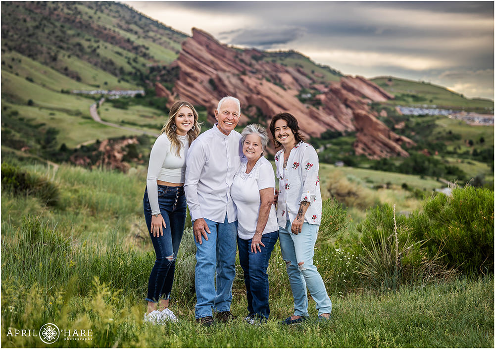 Grandparents with their grandchildren photographed during summer at East Mount Falcon Trailhead with Red Rocks in the backdrop