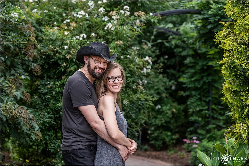 Cute couple portrait for a couple wearing glasses and darker colors at Denver Botanic Gardens in Colorado