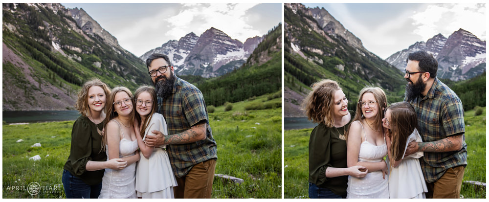 Sweet cuddly photo in front of Maroon Bells backdrop for a family of 4 during summer in Colorado