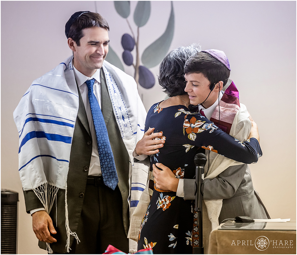 A son hugs his mom on the day of his bar mitzvah in Colorado