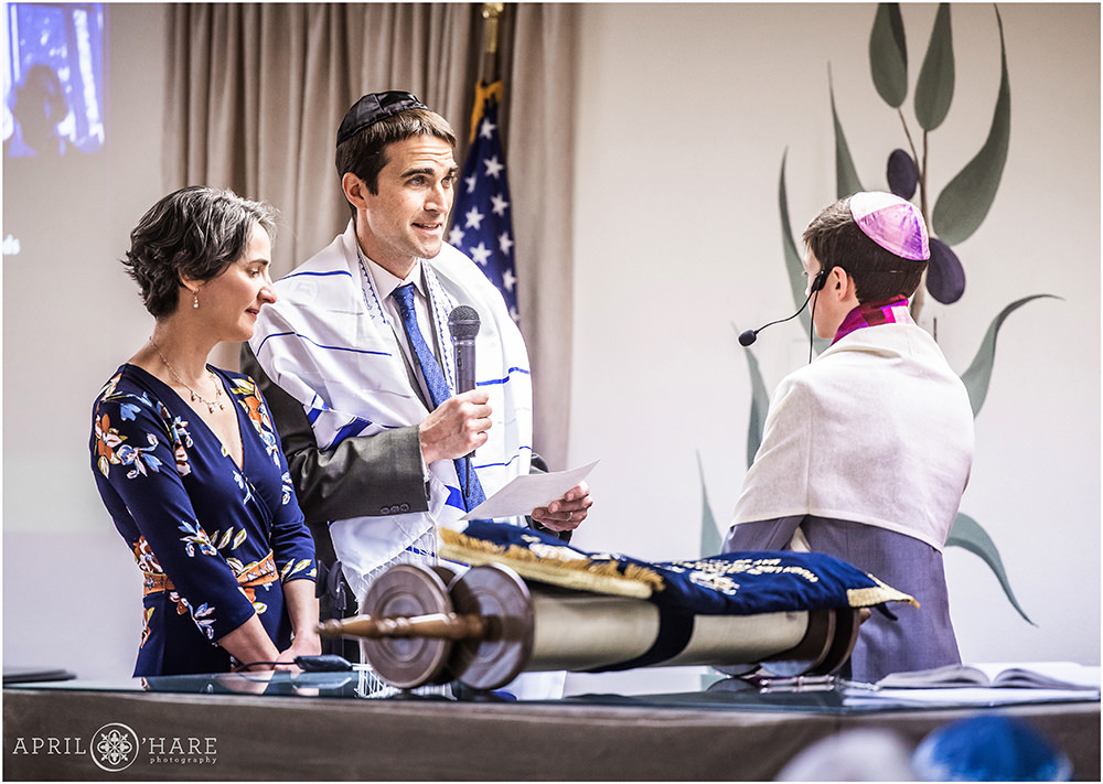 Parents speak to this son on the day of his bar mitzvah at the Temple