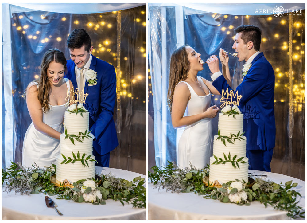 Bride and groom cut their wedding cake inside their tent wedding reception in Colorado