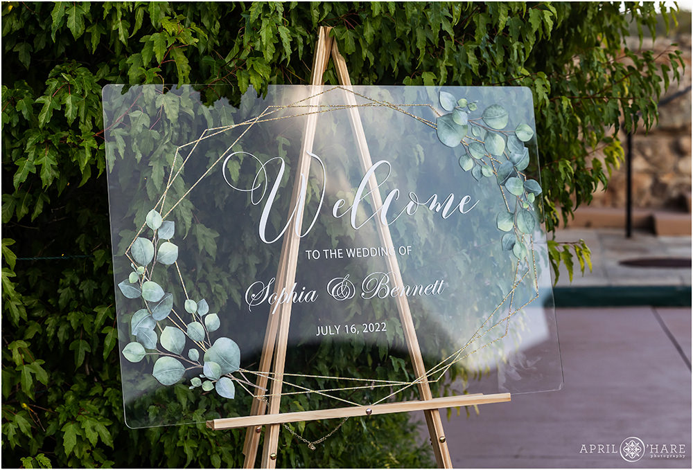 Clear Acrylic Wedding Welcome Sign at a Castle Wedding in Colorado