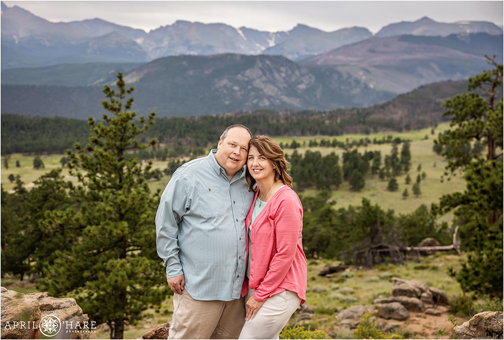 Couples portrait for mom and dad with a beautiful layered mountain backdrop at Rocky Mountain National Park in Colorado