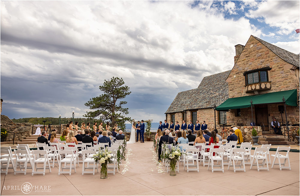Courtyard Wedding Ceremony on a stormy summer evening at Cherokee Ranch and Castle in Colorado