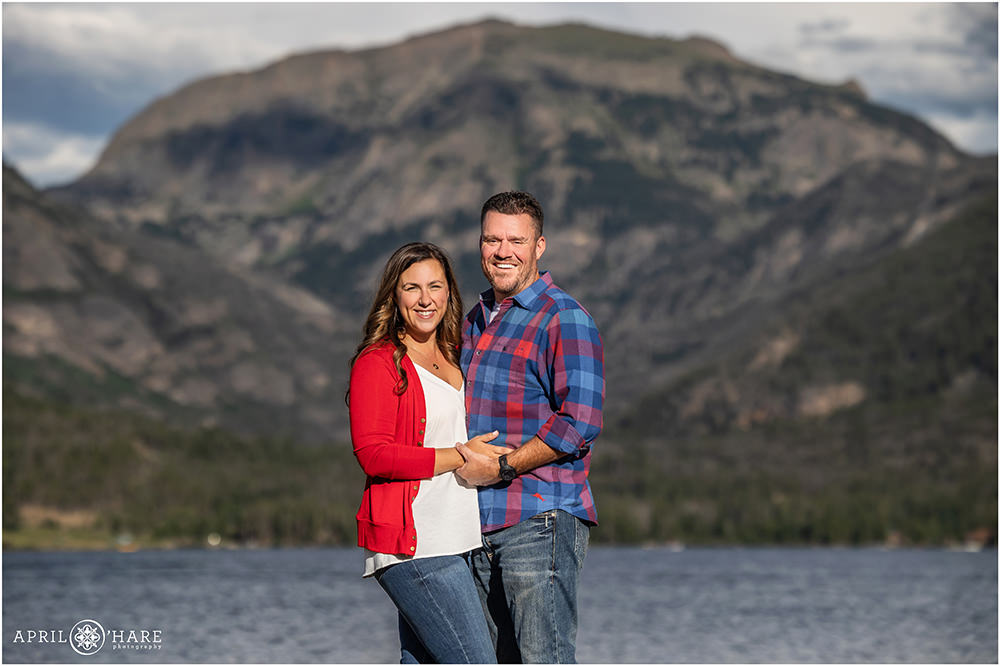 Cute couples photo in front of the mountains in Grand Lake