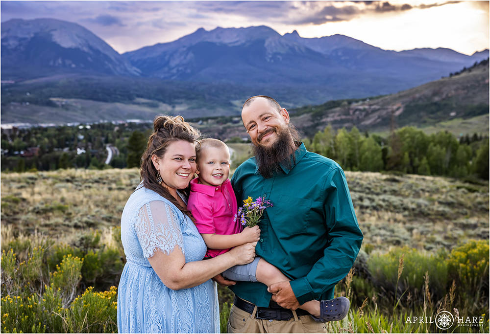 Sweet family photo with a young son with a gorgeous mountain backdrop in Summit County Colorado