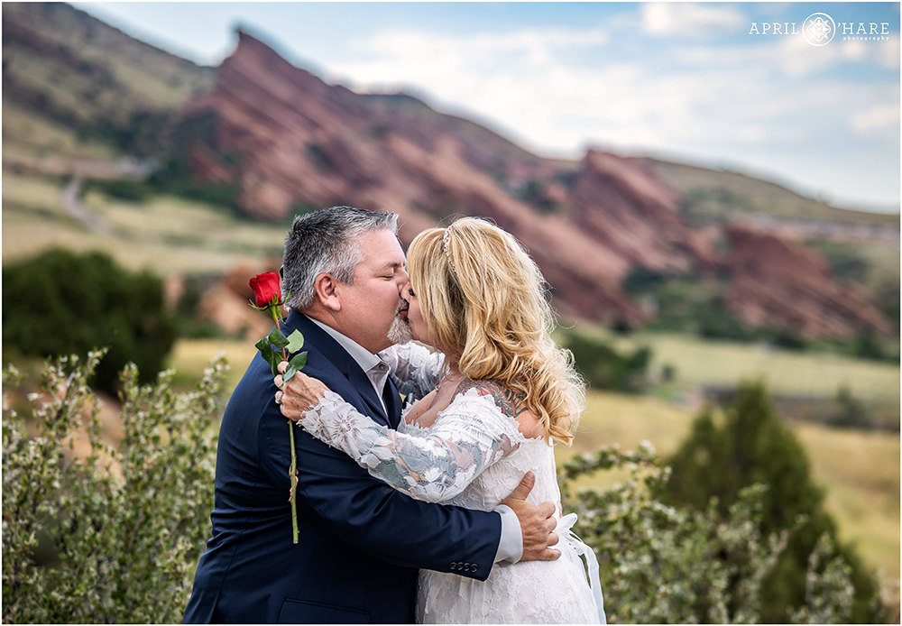 Couple kiss at their outdoor elopement at East Mount Falcon Trailhead
