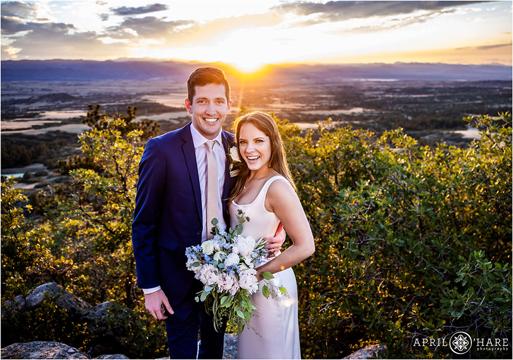 Bride and groom in a beautiful sunset setting with mountain backdrop at Cherokee Ranch and Castle