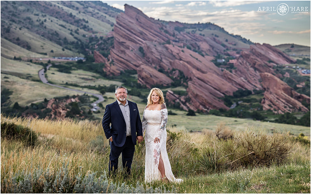 Classic portrait of a couple with Red Rocks Amphitheater in the backdrop at East Mount Falcon Trailhead