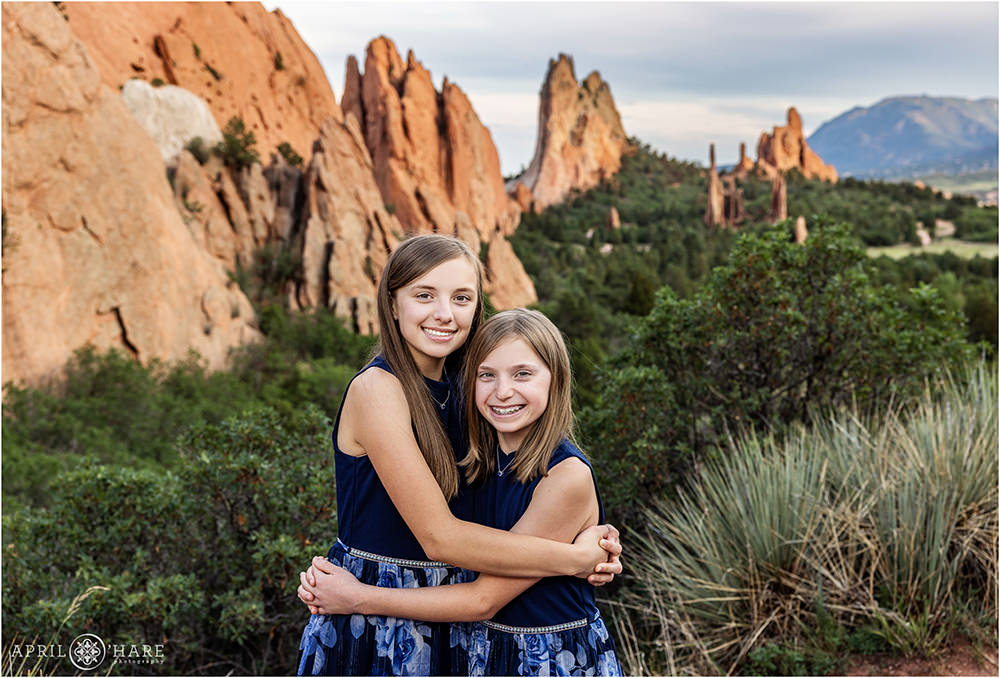Two sisters hug at Garden of the Gods