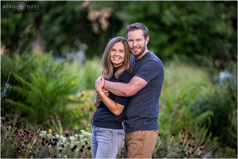 Cute couples portrait in a garden setting in Congress Park Denver CO