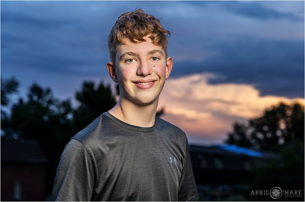 Portrait for a Bar mitzvah boy at Sunset at his backyard bar mitzvah party in Colorado