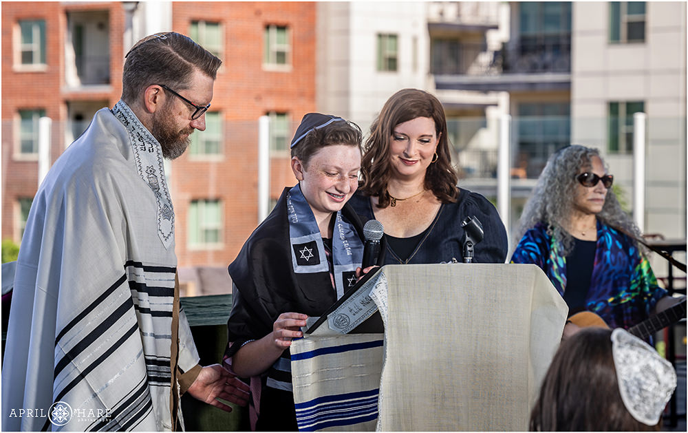 Bar mitzvah boy with his parents at his rooftop deck service at Pindustry