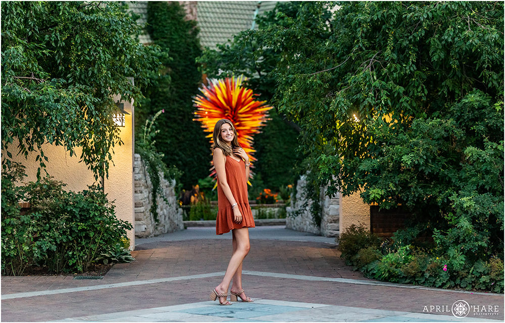 Beautiful high school senior portraits with the Chihuly Sculpture at Denver Botanic Gardens in Colorado