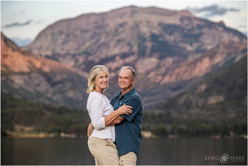 Cute couples portrait with mountain and lake backdrop at Point Park in Grand Lake Colorado