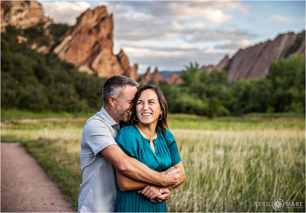 Cute couples portrait along the trail at Roxborough State Park during summer