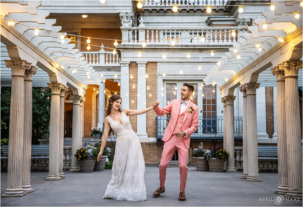 Cute photo of a couple dancing outside on the patio at Grant-Humphreys Mansion in Denver