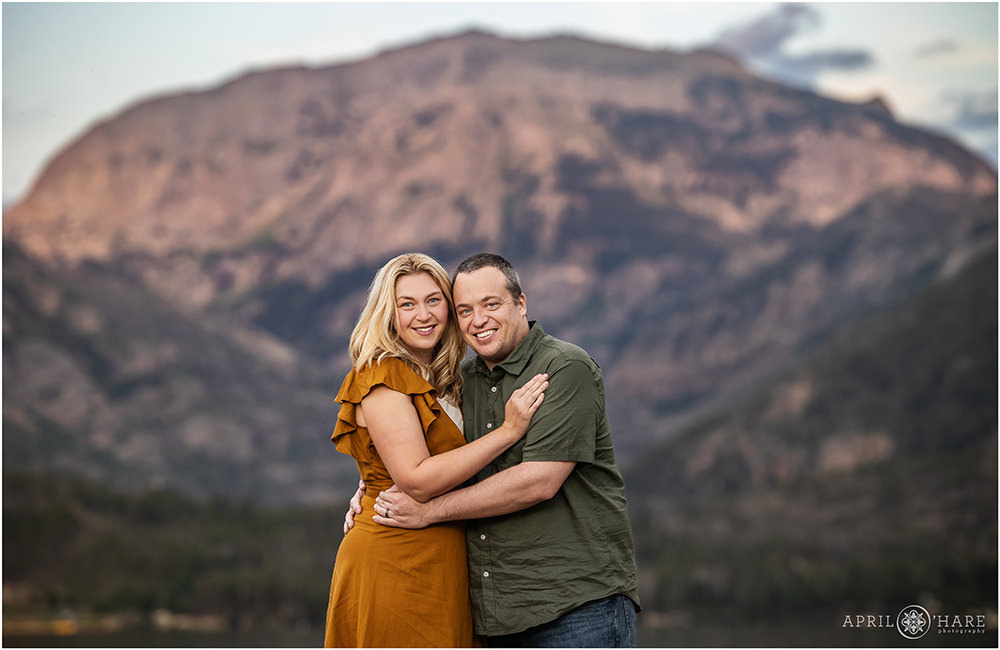 Couples portrait with purple mountain backdrop at Point Park in Grand Lake Colorado