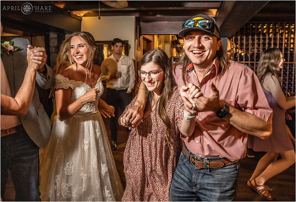 Wedding guests have fun dancing at Craftwood Inn in Manitou Springs