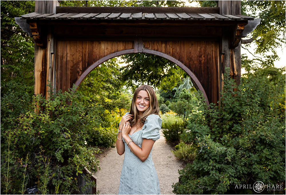 Cute high school senior portrait with circle gate at Denver Botanic Gardens in Colorado