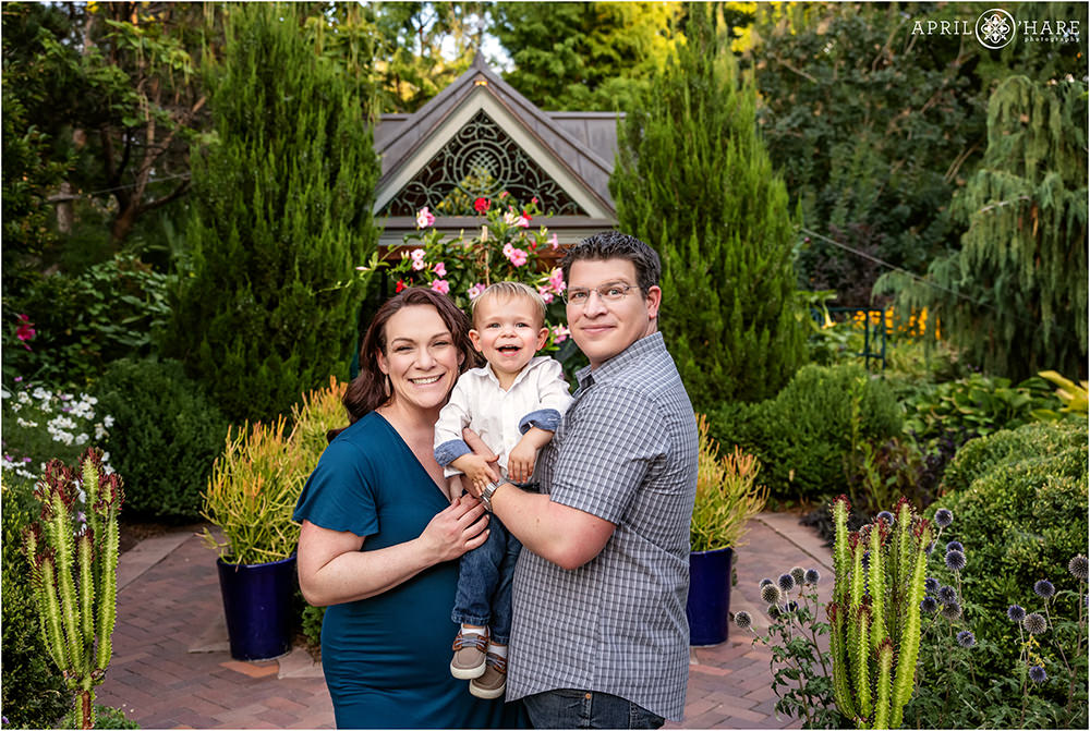 Sweet family of 3 with another one on the way are photographed in the beautiful scenery of Denver Botanic Gardens