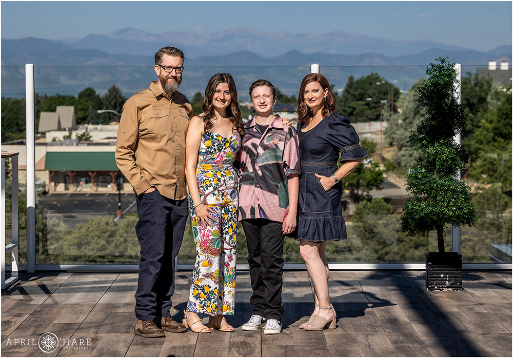 Family portrait on the rooftop deck at Pindustry for a bar mitzvah on a bright sunny day in Colorado