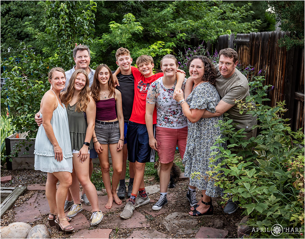 Family friends in the garden at a backyard bar mitzvah party in Colorado
