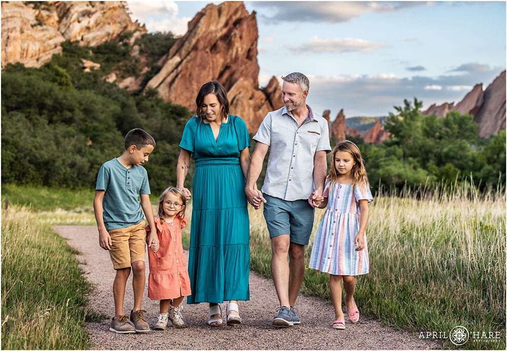 Sweet family walk along the path together at Roxborough State Park in Littleton CO