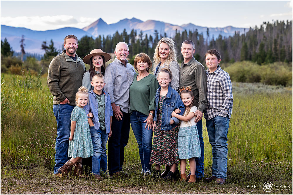 Beautiful mountain backdrop for an extended family portrait during summer in Grand Lake