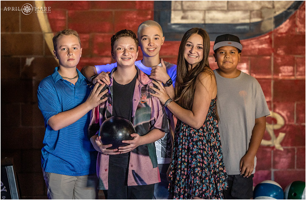 Kids pose for a photo while bowling at Pindustry bar mitzvah party