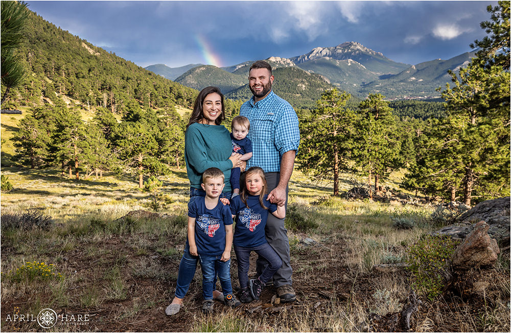 Rainbow mountain backdrop for a family portrait inside of RMNP in Colorado