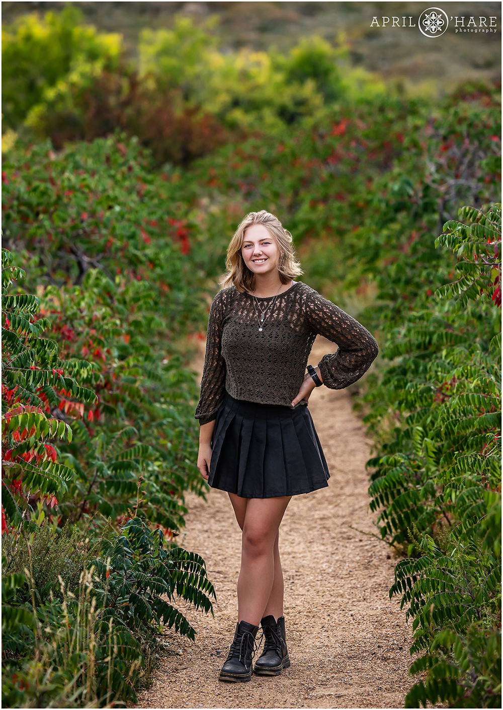Red and green sumac leaves at South Mesa Trail for a high school senior portrait