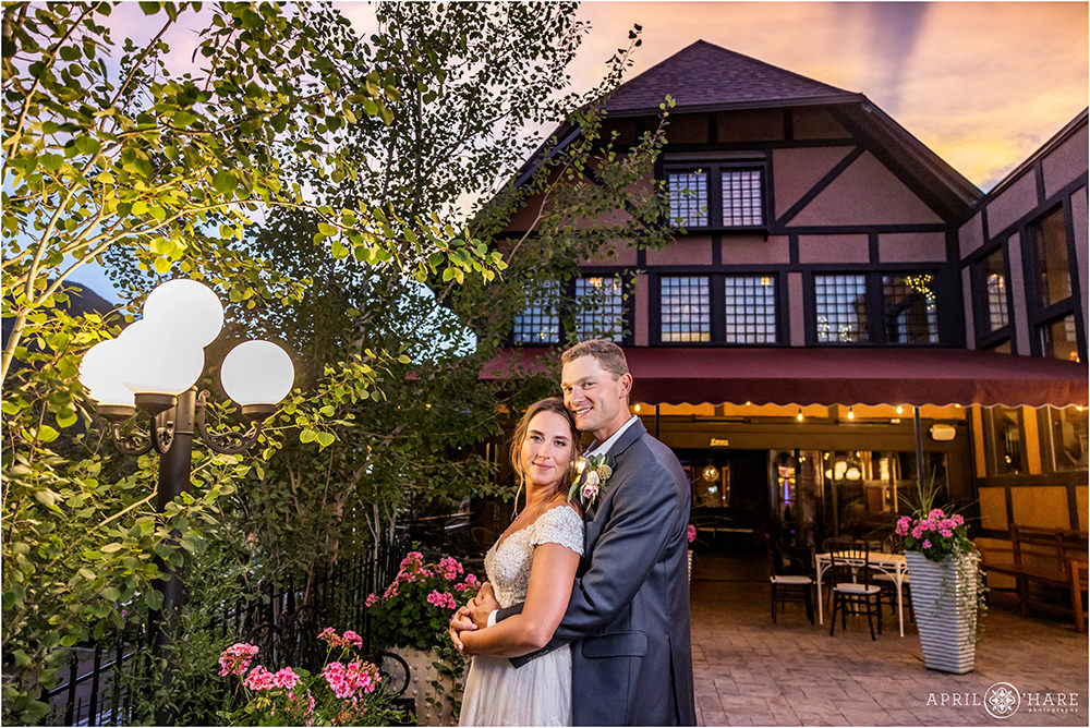 Beautiful sunset wedding portrait on the patio at Craftwood Inn in Manitou Springs CO