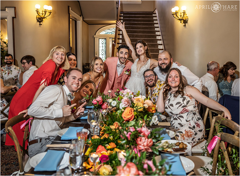 Friend group photo of Bride and groom with guests at Grant-Humphreys Mansion in Denver