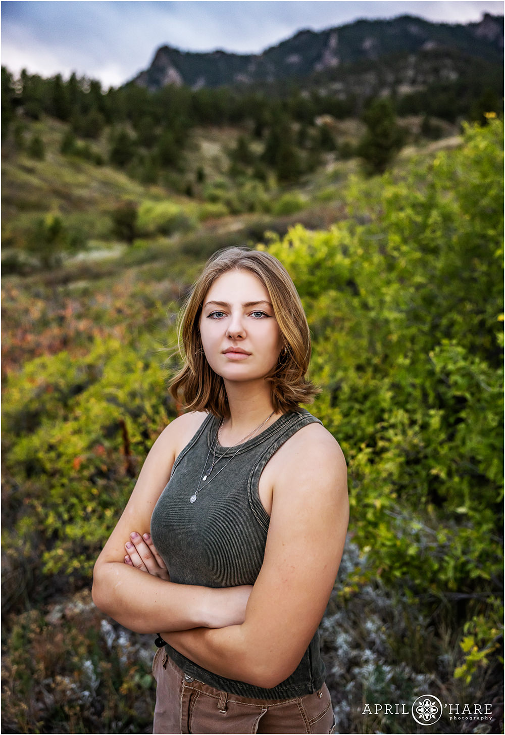 Serious pose from a high school senior in the gorgeous scenery of South Mesa Trail in Boulder