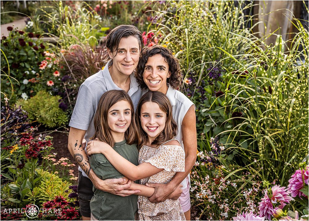 Adorable family of four with two daughters in the gorgeous gardens of Denver Botanic Gardens
