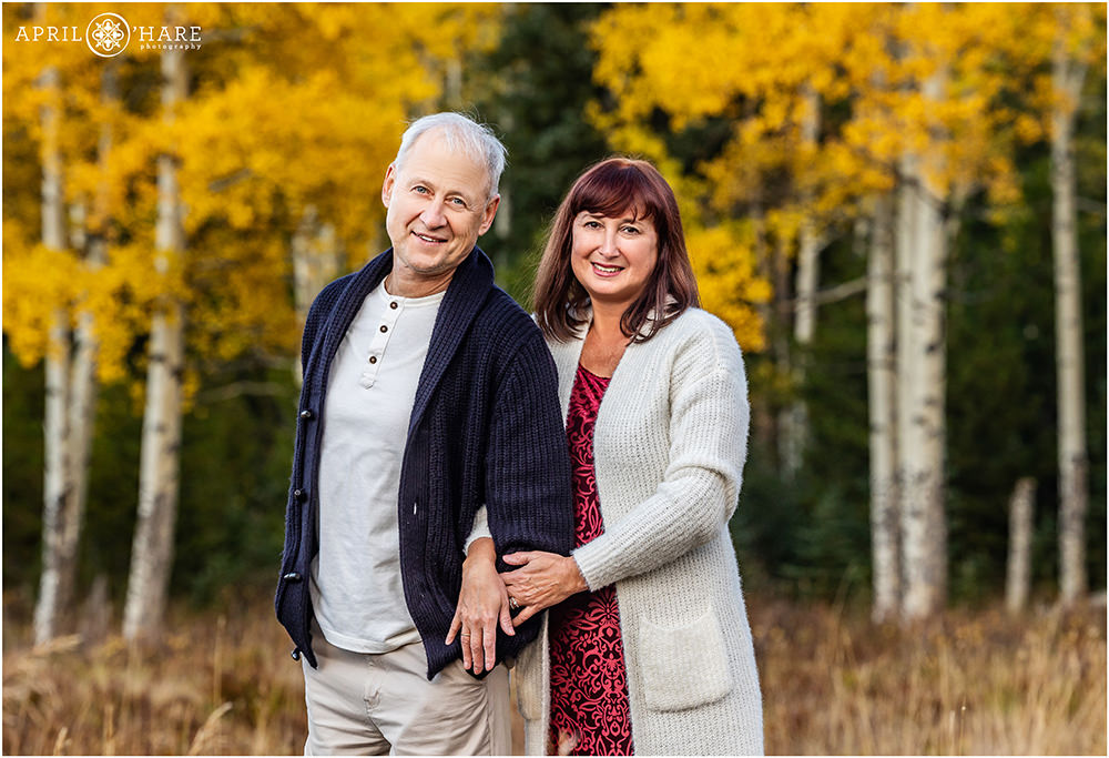 Grandparents get a beautiful photo together with a pretty aspen tree backdrop at Squaw Pass Road in Evergreen CO