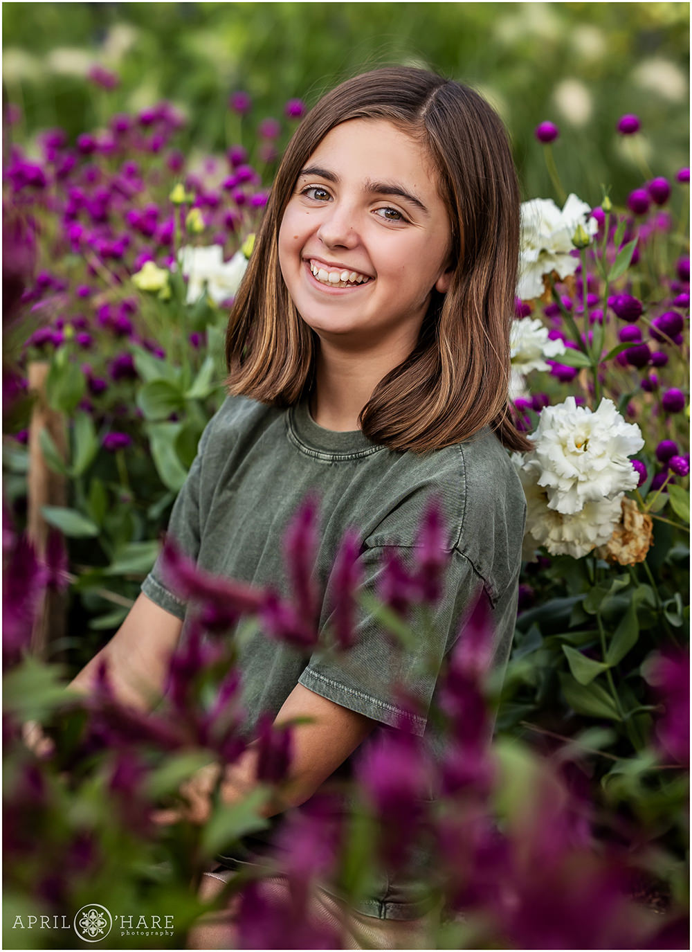 Cute headshot photo of a tween at her family portrait session at Denver Botanic Gardens