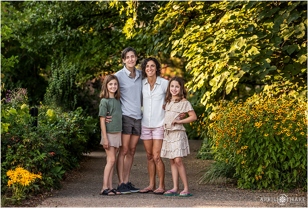 Full length family of four photo along a beautiful garden path at Denver Botanic Gardens