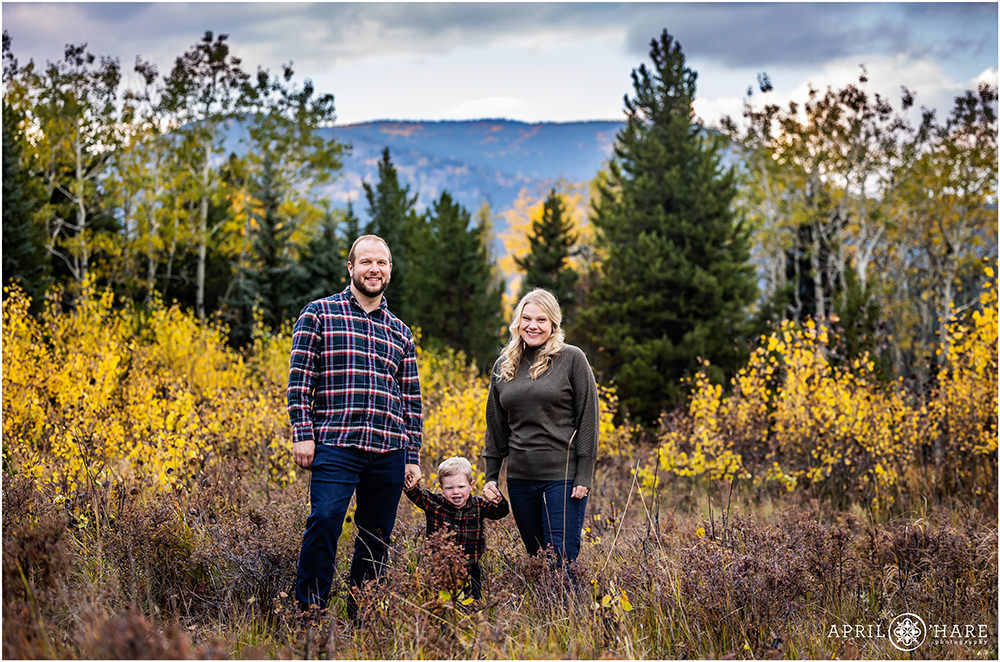 Cute family portrait with toddler son in the fall color on Squaw Pass Road