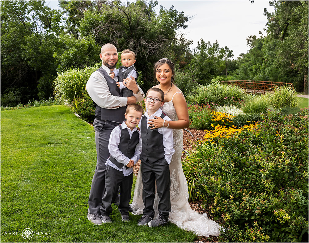 Family portrait of bride and groom with their 3 sons at Wellshire Event Center
