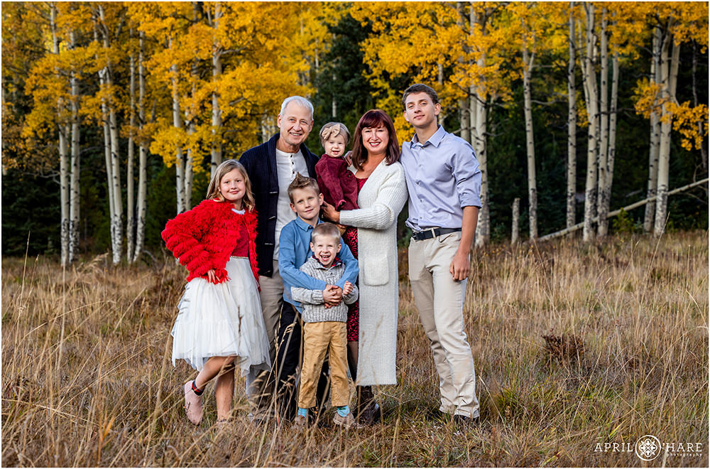 Grandparents get a photo with all of their grandkids in the fall color on Squaw Pass Road in Evergreen CO
