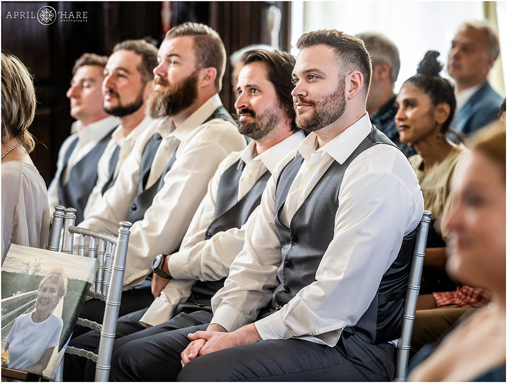 Groomsmen at an indoor wedding ceremony at Wellshire Event Center