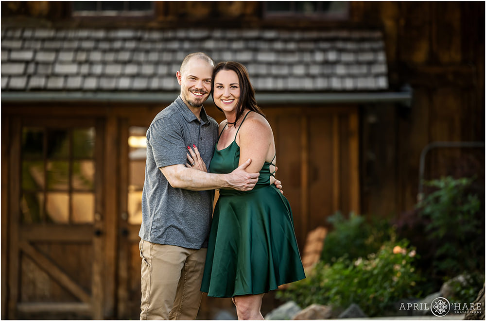 Couple portrait with historic brown barn backdrop at Belmar Park in Lakewood