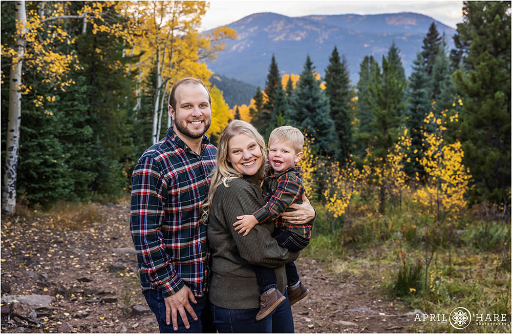Family of three with a 2 year old toddler son in the fall color on Squaw Pass Road