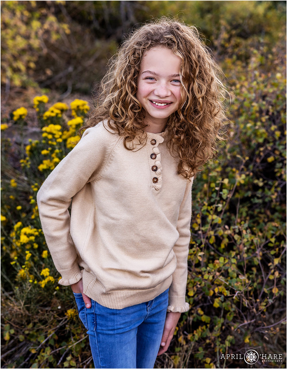 Fall color portrait for a tween girl with curly hair at East Mount Falcon in Morrison Colorado
